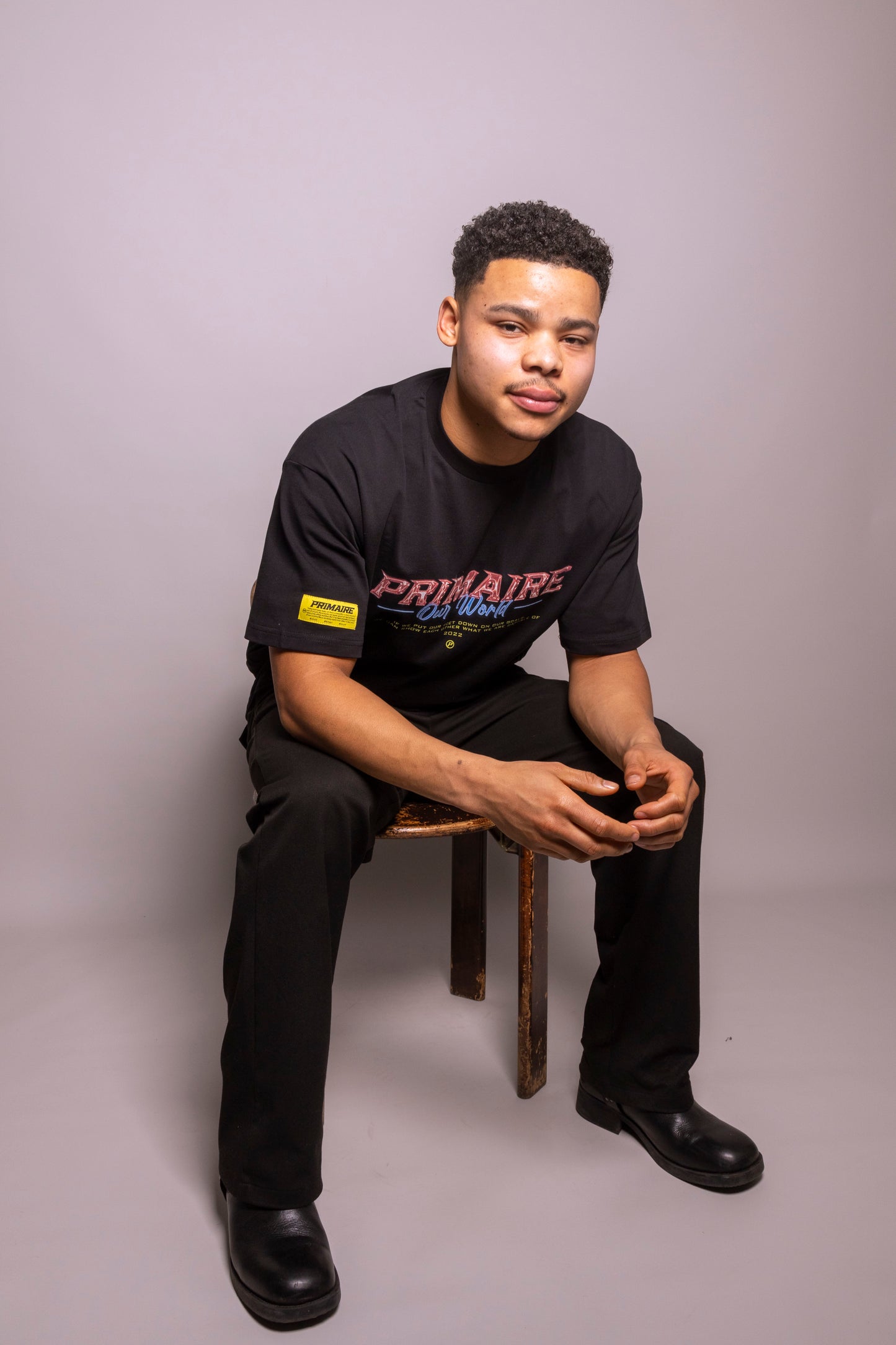 ‘Our world’ black tee
